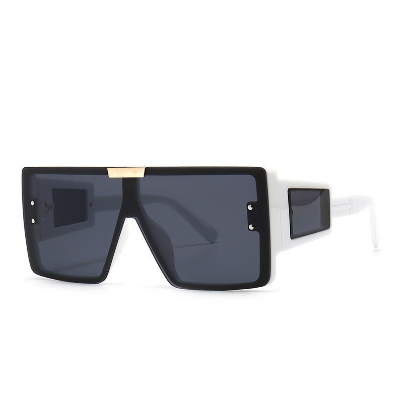 Large frame sunglasses with widened legs and patch sunglasses