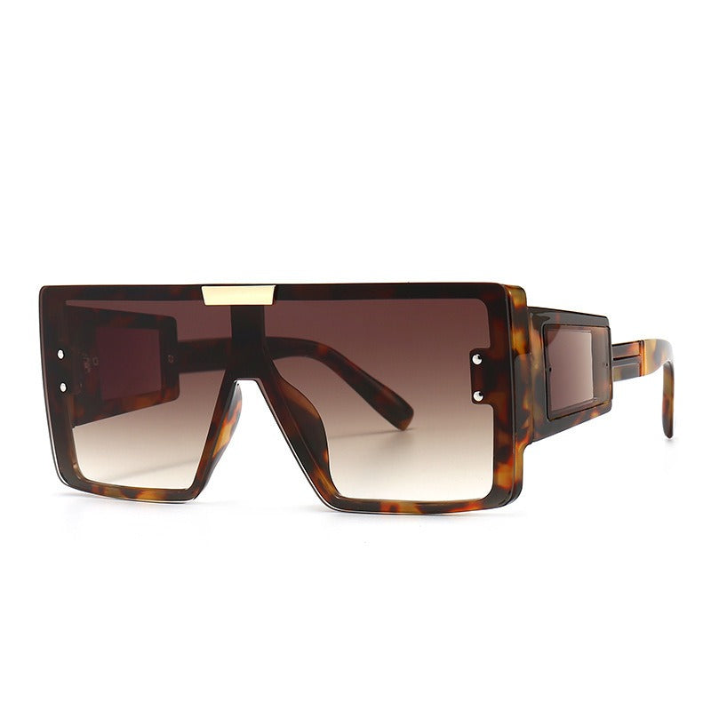 Large frame sunglasses with widened legs and patch sunglasses